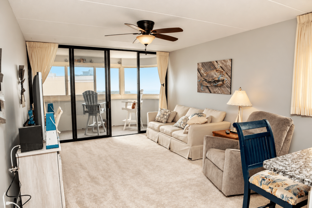 Bright Coastal Living Room with Sunroom Views