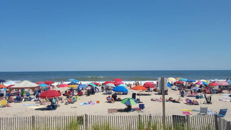 Colourful beach umbrellas and families on the sand at Bethany Beach, Delaware