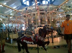 Historic hand-carved carousel lit up inside Trimper Rides on the Ocean City boardwalk
